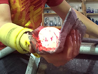 Hand Shaping Molten Coloured Glass Into A Bauble